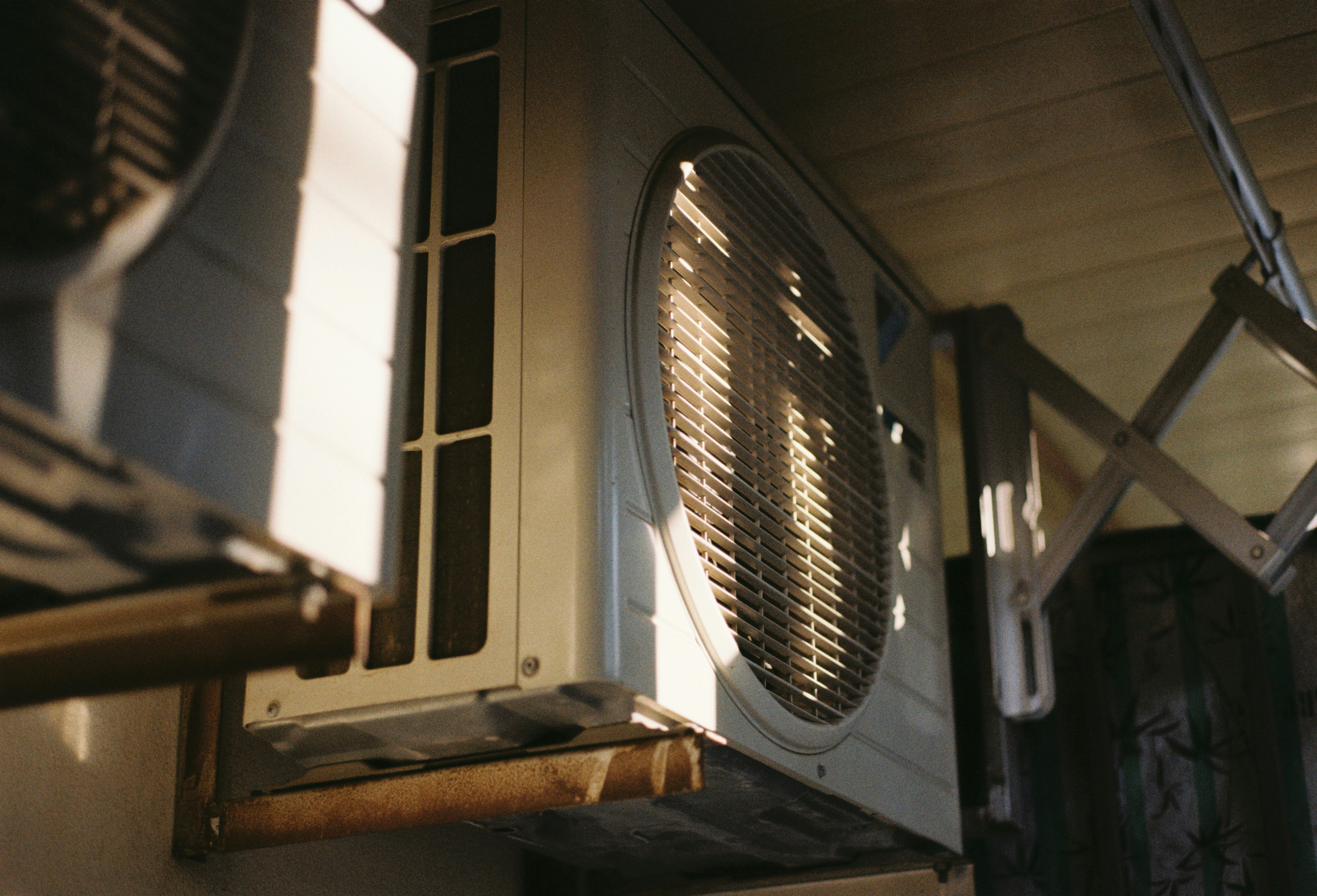 Close-up of an outdoor air conditioning unit on a sunny day